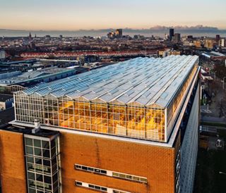 Photo @lucalocatelliphoto for @natgeo Growing locally inside a city is a trend everywhere and the Dutch have their own way. This futuristic project  is the Urban Farmer greenhouse,  built on the rooftop of a former Philips building it  can harvest fresh vegetables for approximately 300kg  per week, without using  pesticides. The Netherlands  has become an agricultural giant and it propose the most advanced high tech agro farming solutions to grow more with less.  Follow me @lucalocatelliphoto to see more about this story published on the National Geographic Magazine, September issue.  #hunger #food #foodcrisis #agriculture #greenhouse #sustainable #organic #solution #green #modern #modernfarmer #future #futuristic #netherlands #drone #dronephotography transition #drone #dronefly #dronevideos #dronephotography #urbanfarmers #rooftop #roofopfarmer